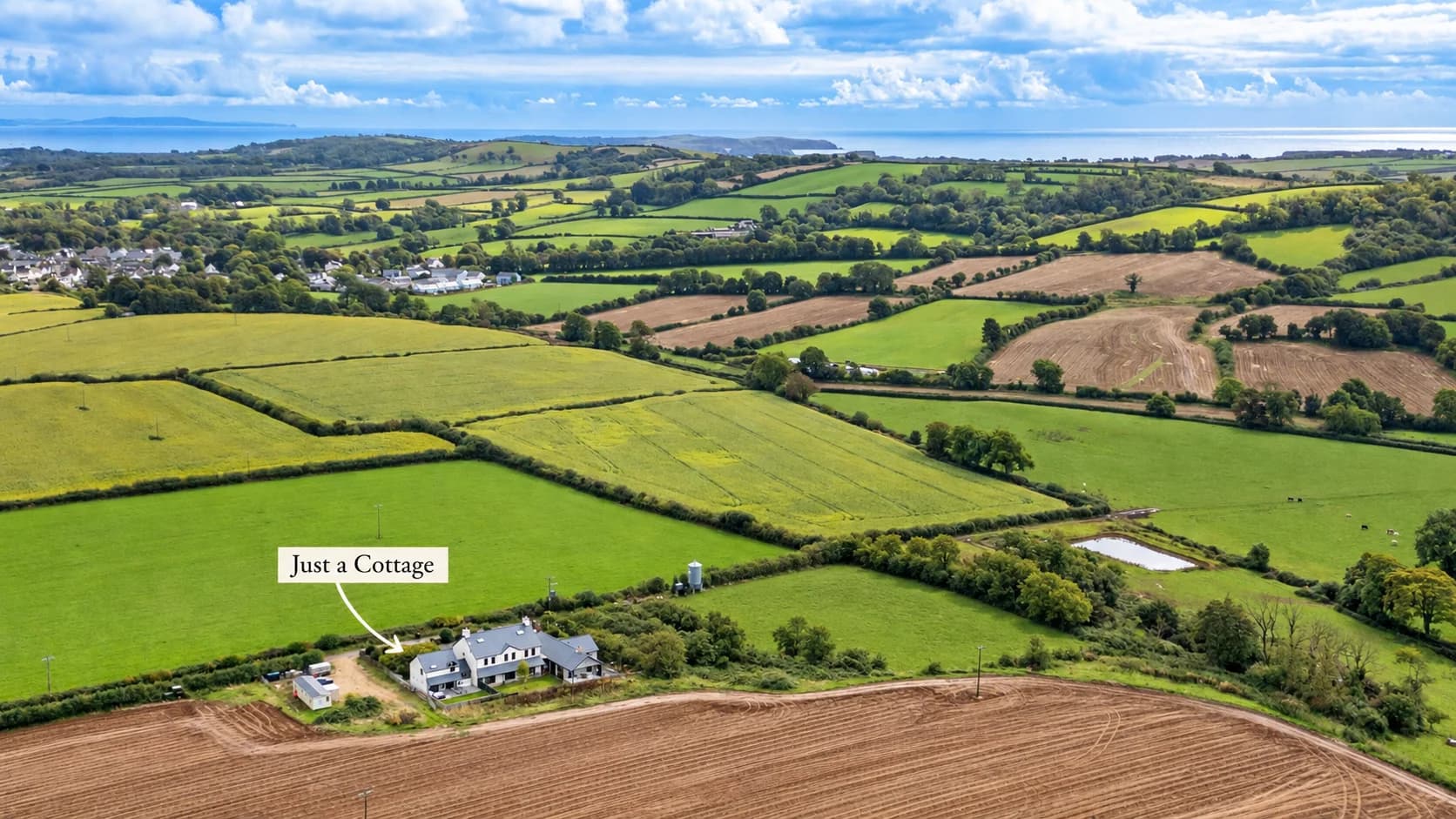 Aerial view showing Just a Cottage and the surrounding Pembrokeshire coastline