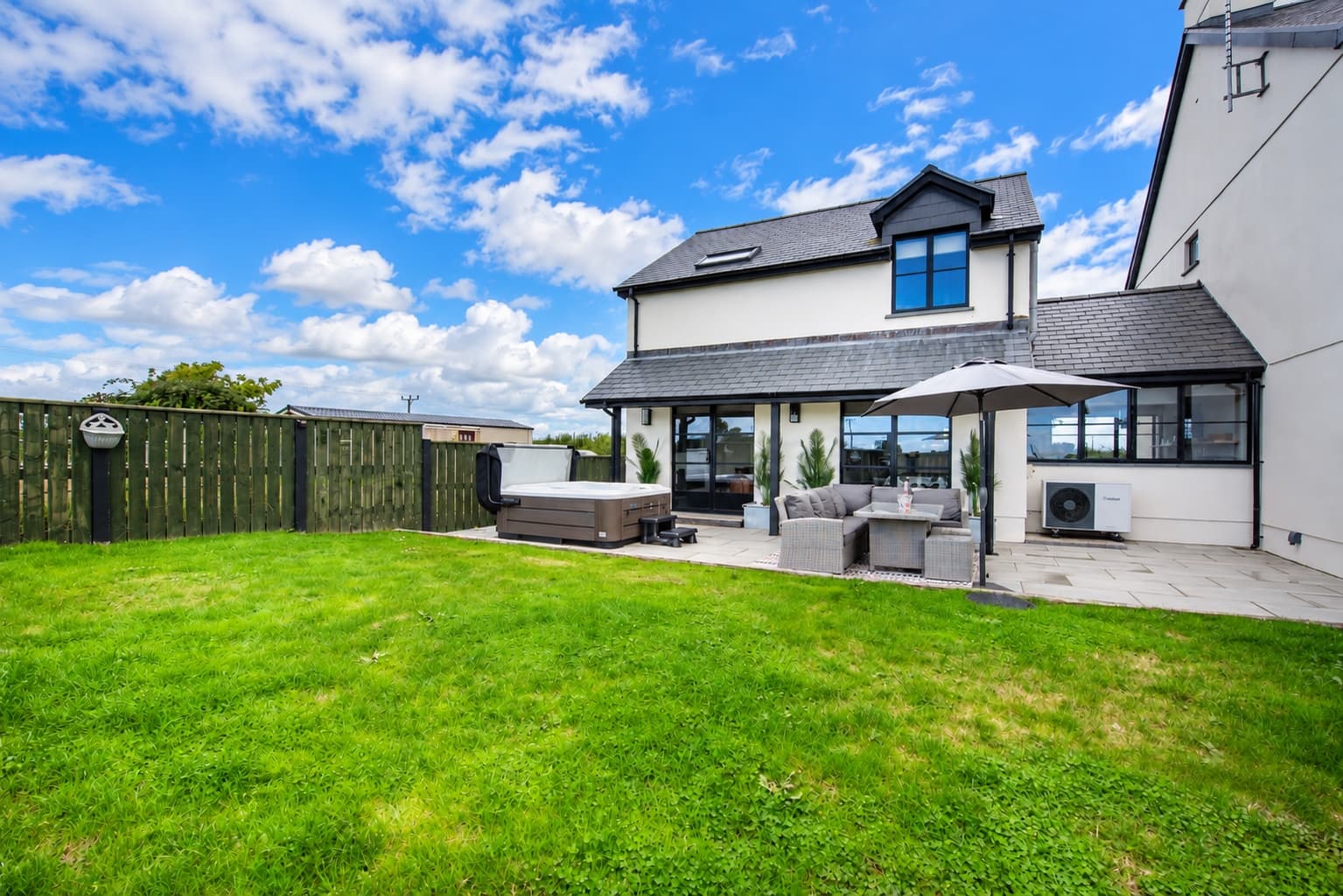 Just a Cottage exterior with garden and hot tub, Jordanston Farm near Tenby
