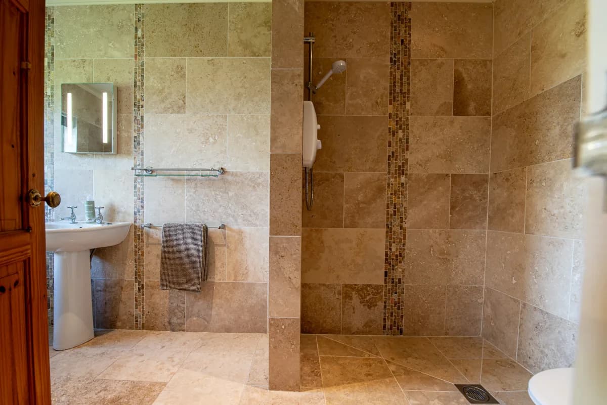 Family bathroom walk-in shower at Pleasant Valley