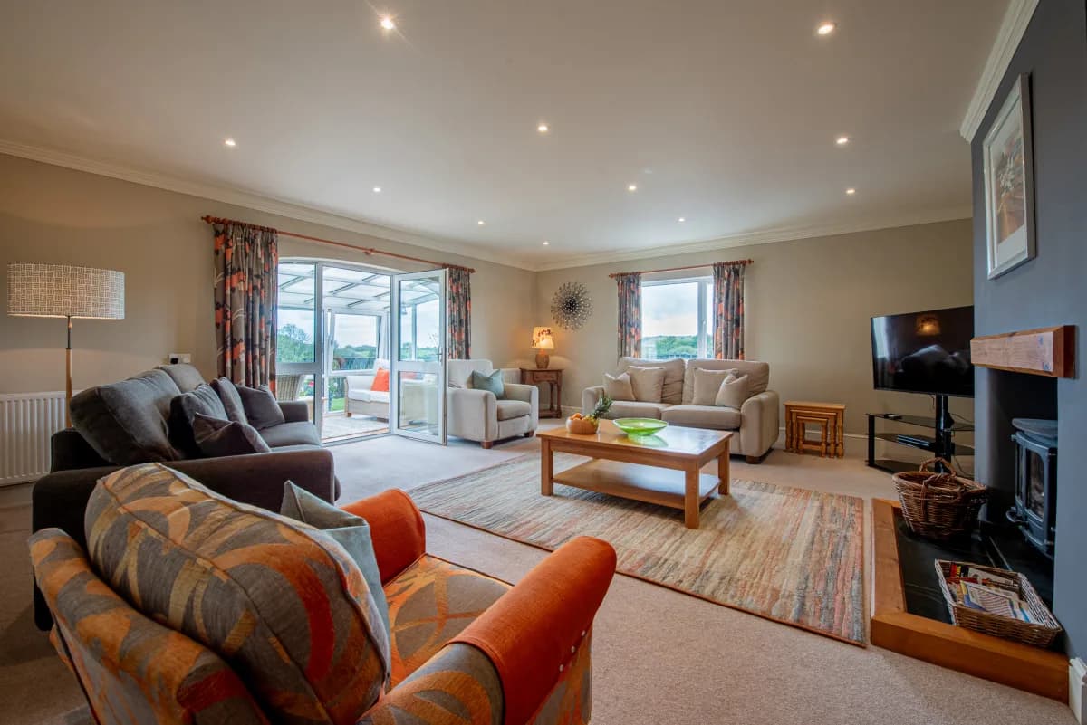 Living room with woodburner at Pleasant Valley