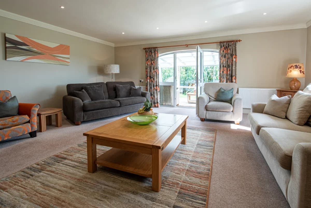 Living room with conservatory doors at Pleasant Valley