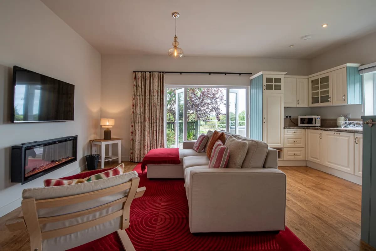 Living area with kitchen and fireplace at Pleasant Valley View