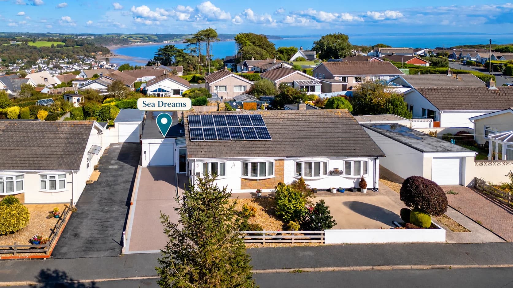 Aerial view of Sea Dreams bungalow in Saundersfoot, with the sea beyond