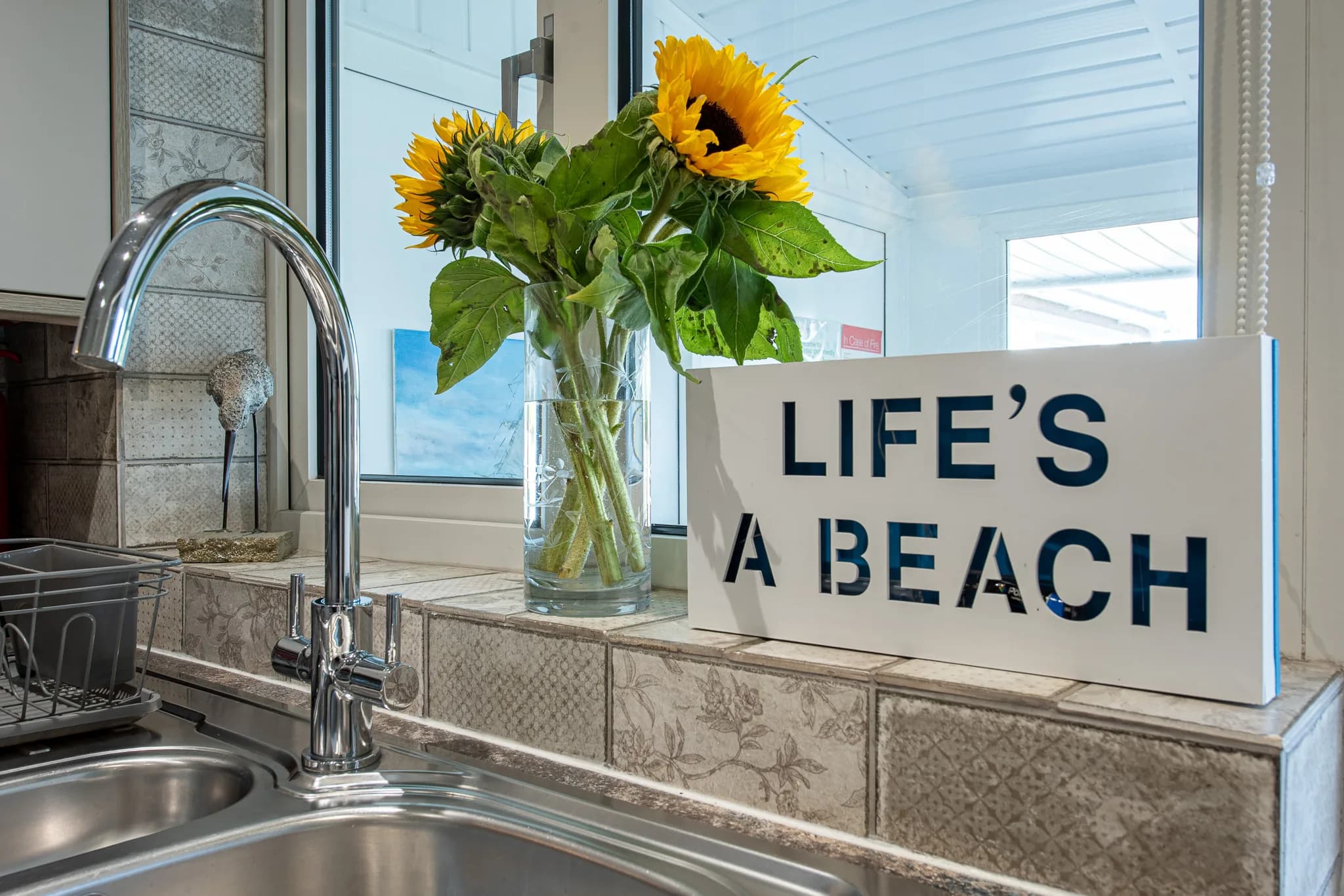 Kitchen sink by the window at Sea Dreams