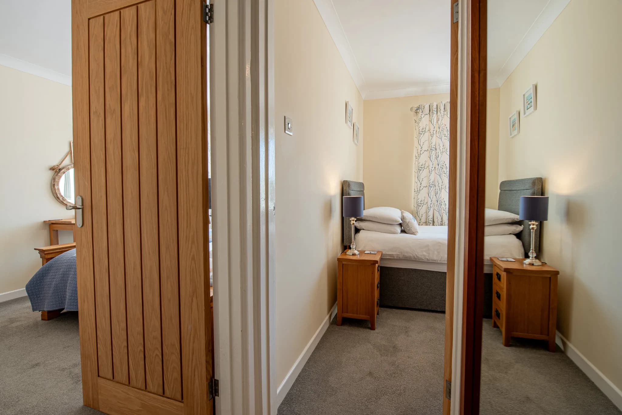 Twin bedroom seen through the doorway at Sea Dreams